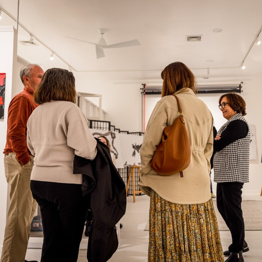 Patrons enjoying a gallery event